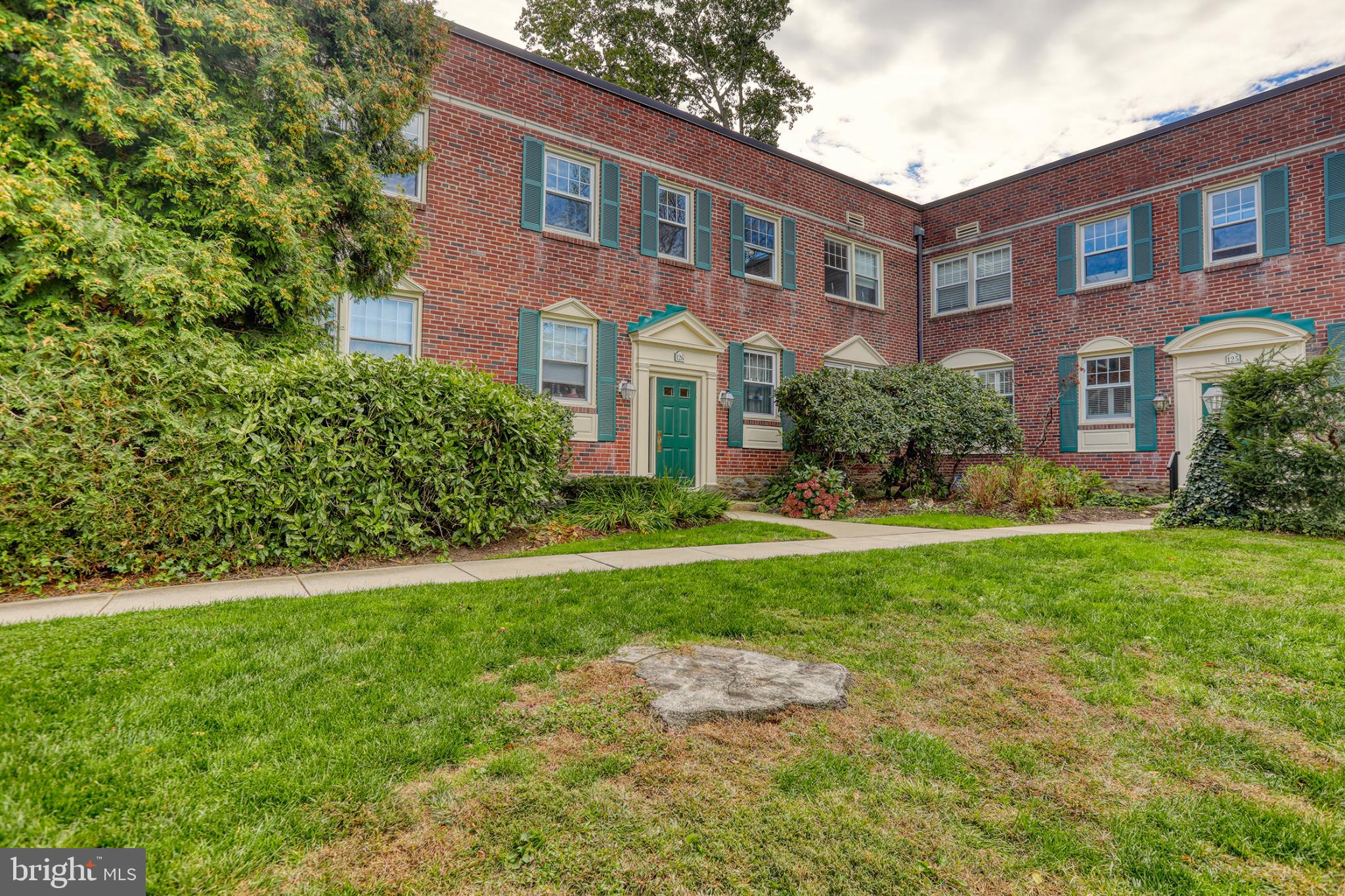 500 East Lancaster Avenue, Unit 126A Wayne, PA 19087 - Photo 19 of 22 Charming brick residence with lush greenery.