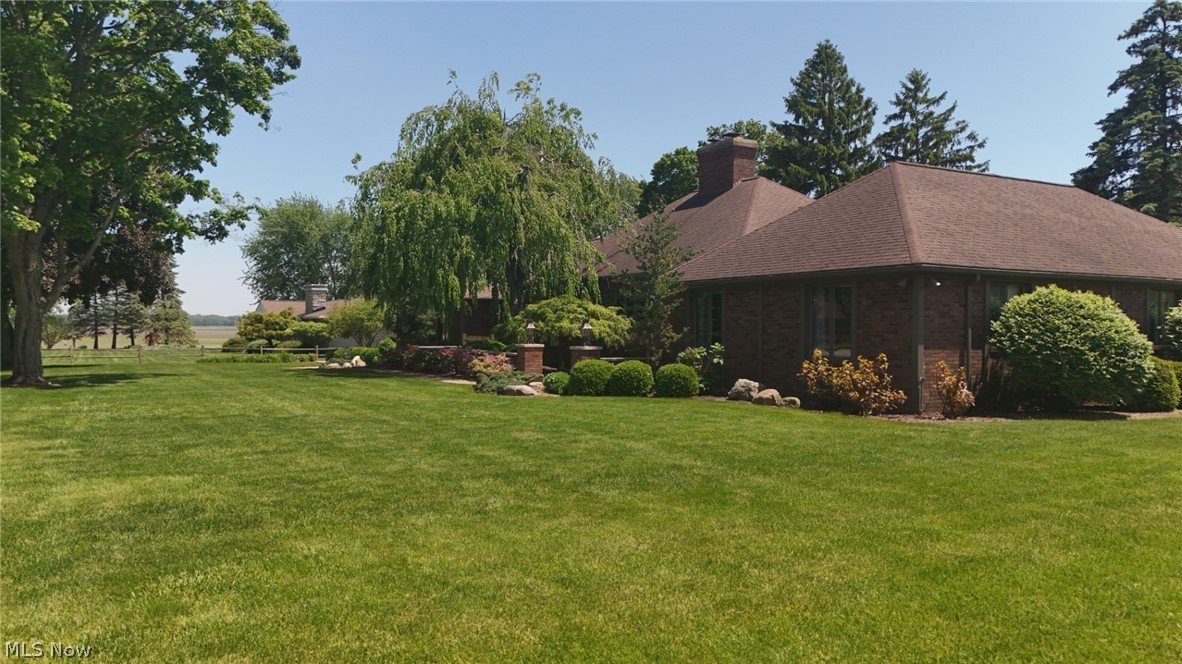 3985 Wiers Road Willard, OH 44890 - Photo 2 of 50 Expansive green lawn with mature trees and established landscaping