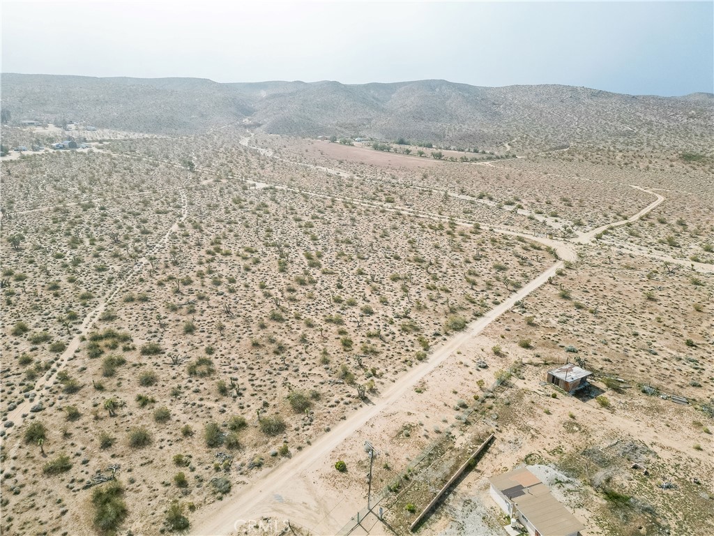 0 Lincoln Road Lucerne Valley, CA 92356 - Photo 2 of 12 a view of a dry yard and mountain