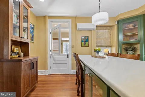 a very nice looking room with a large window and kitchen view