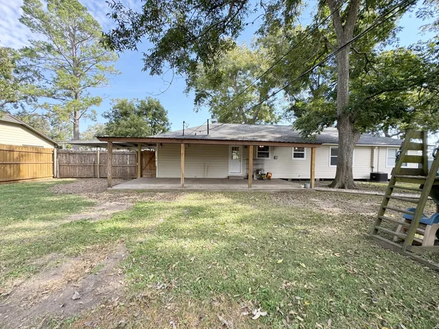 a backyard of a house with seating space