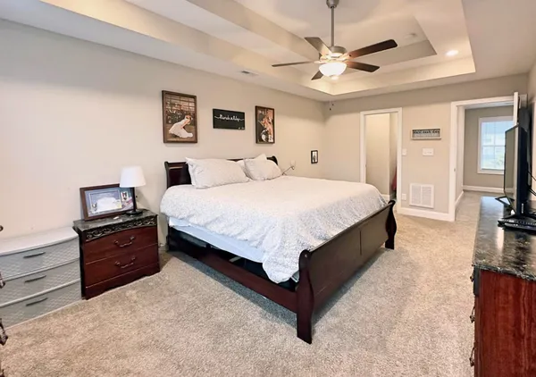 a bed room with a bed and a tv