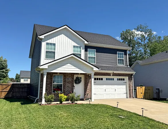 front view of a house with a yard