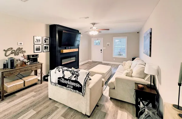 a bedroom with a bed and a television