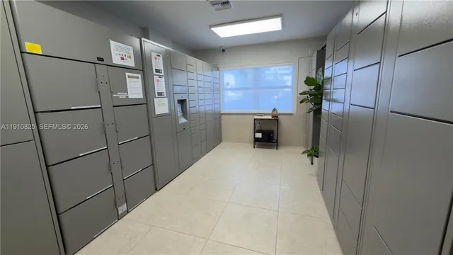 a kitchen with cabinets and a refrigerator
