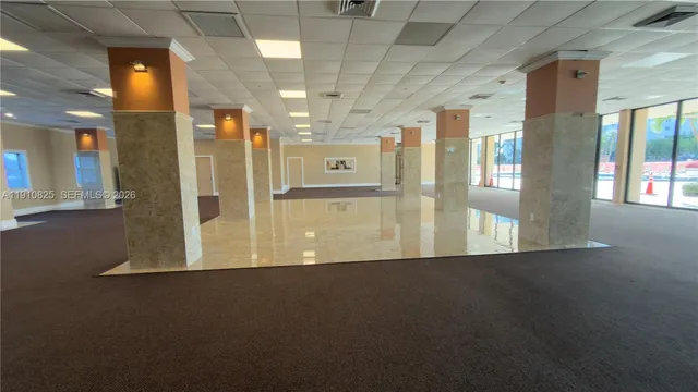 a view of a hallway with a room