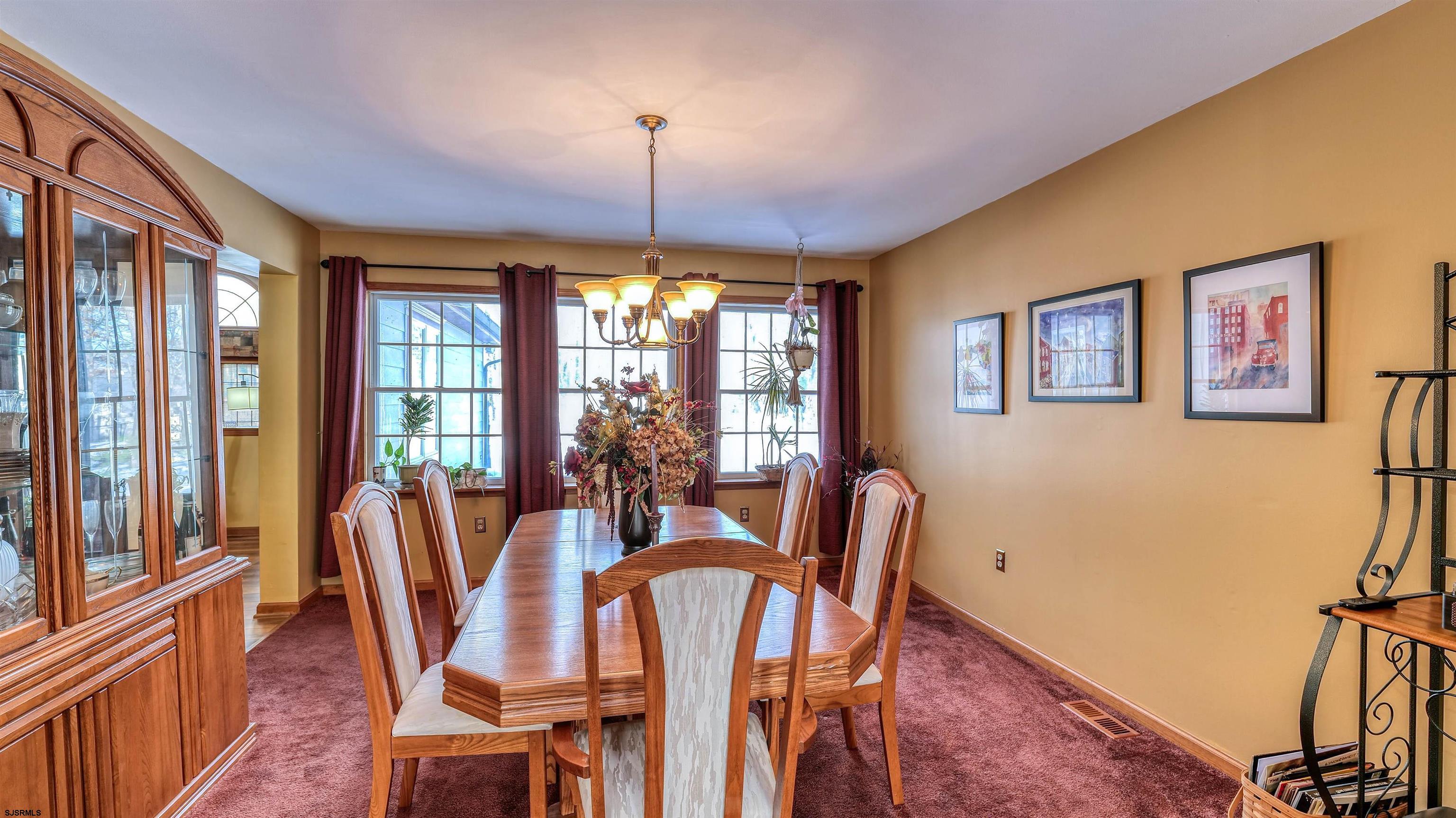 627 East Seaview Ridge Drive Galloway Township, NJ 08205 - Photo 16 of 50 a view of a dining room with furniture window and wooden floor