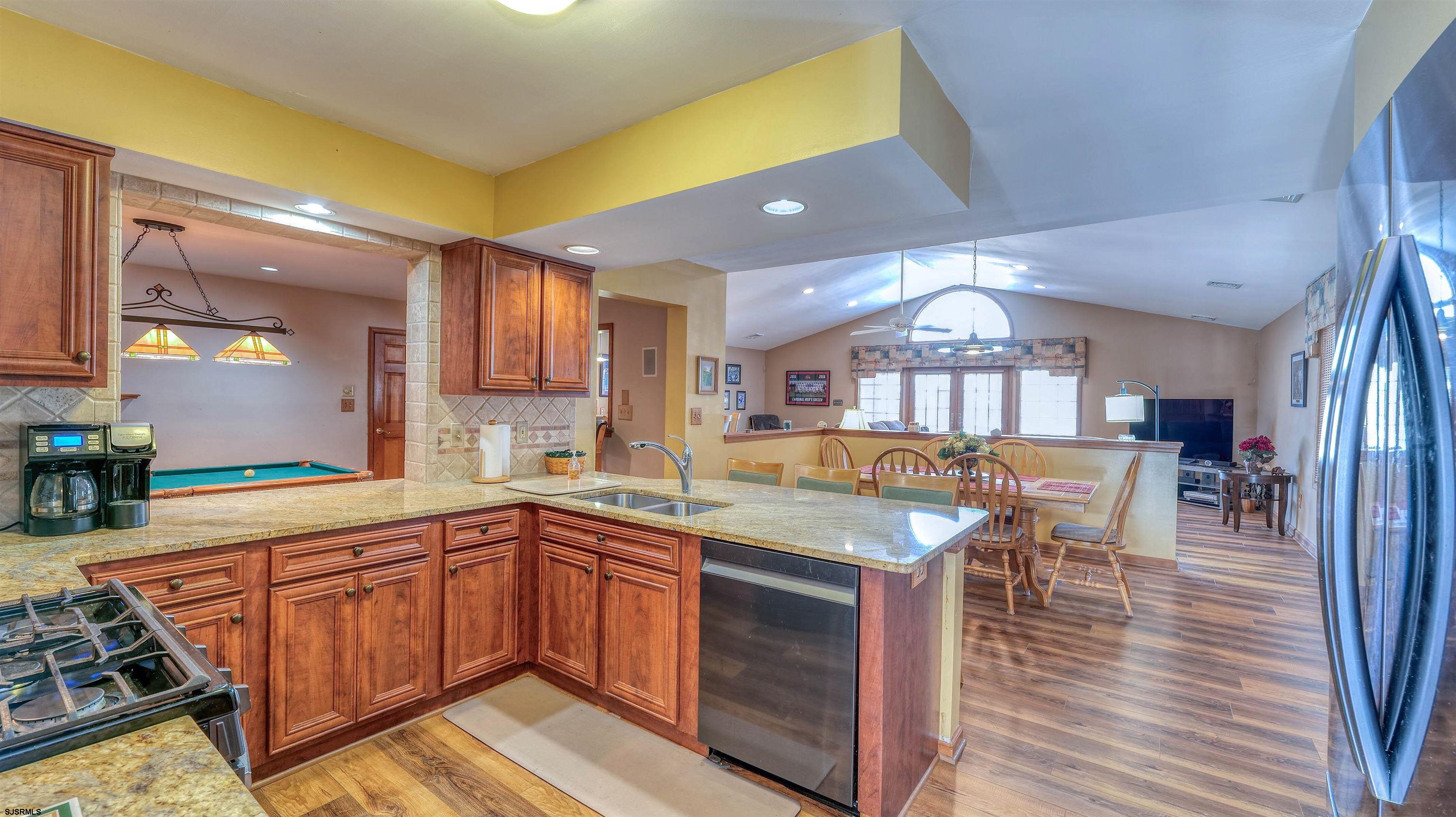627 East Seaview Ridge Drive Galloway Township, NJ 08205 - Photo 20 of 50 a kitchen with a sink cabinets and wooden floor