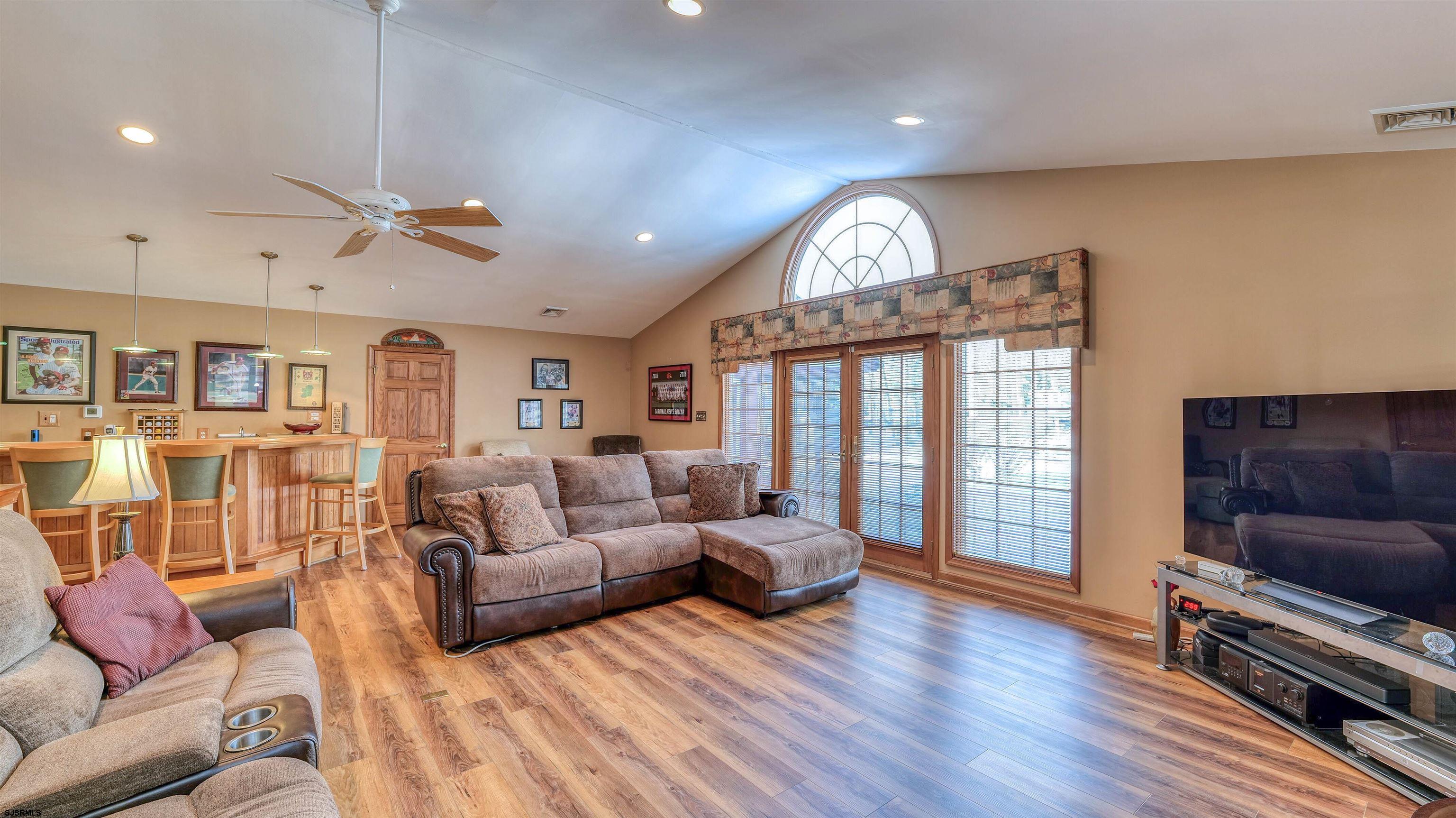 627 East Seaview Ridge Drive Galloway Township, NJ 08205 - Photo 22 of 50 a living room with furniture and a flat screen tv