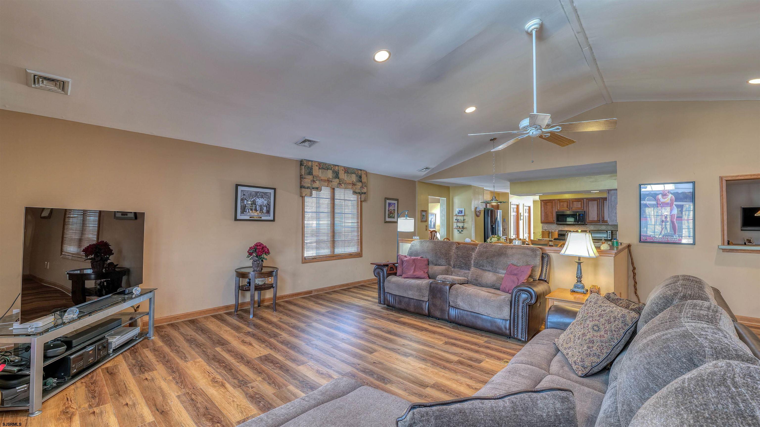627 East Seaview Ridge Drive Galloway Township, NJ 08205 - Photo 23 of 50 a living room with furniture and a flat screen tv