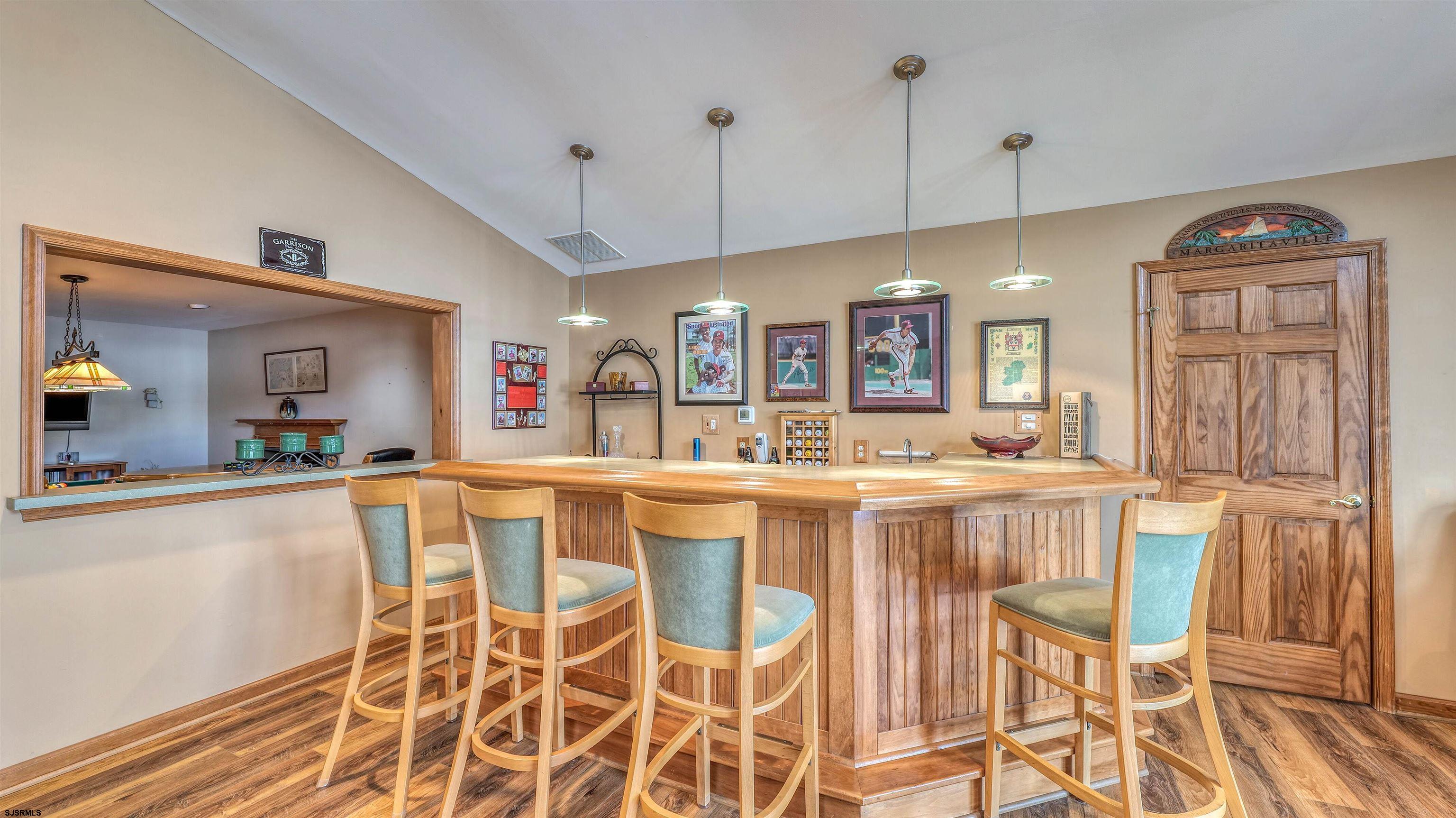 627 East Seaview Ridge Drive Galloway Township, NJ 08205 - Photo 24 of 50 a large kitchen with a table and chairs in it