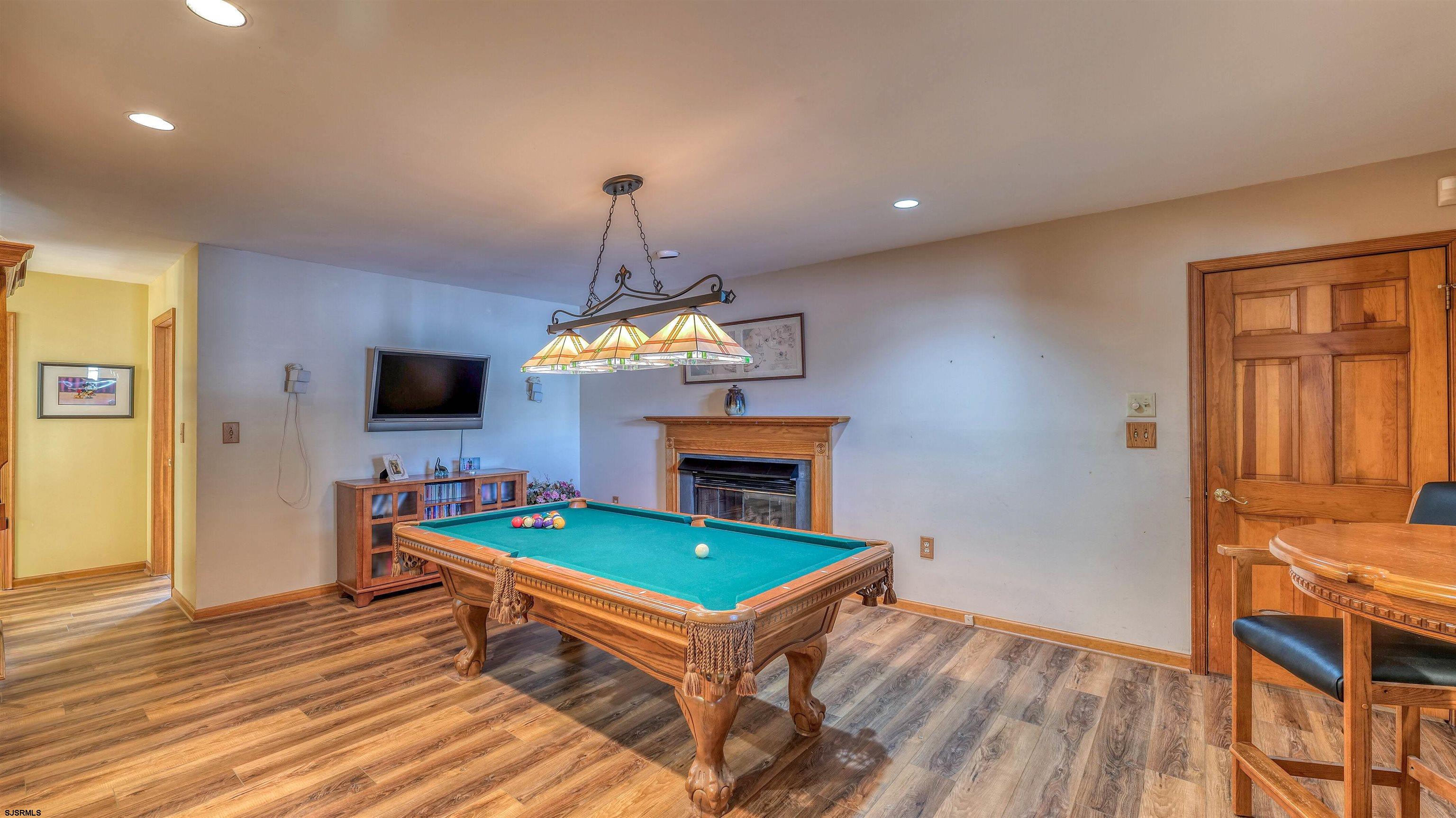627 East Seaview Ridge Drive Galloway Township, NJ 08205 - Photo 26 of 50 a living room with furniture a flat screen tv and kitchen view