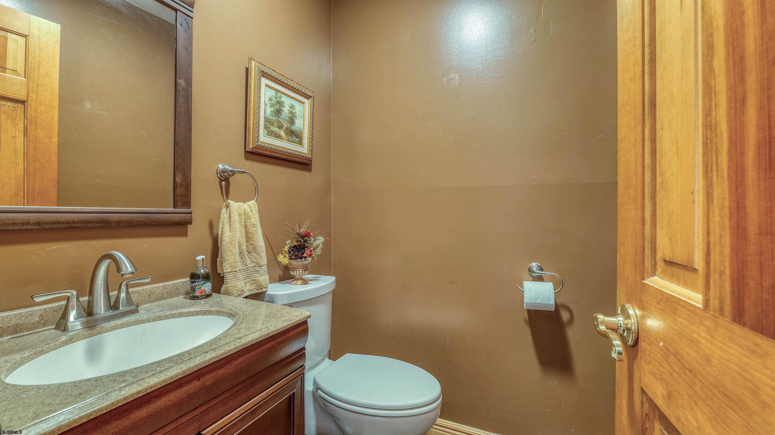 627 East Seaview Ridge Drive Galloway Township, NJ 08205 - Photo 29 of 50 a bathroom with a granite countertop sink and a mirror