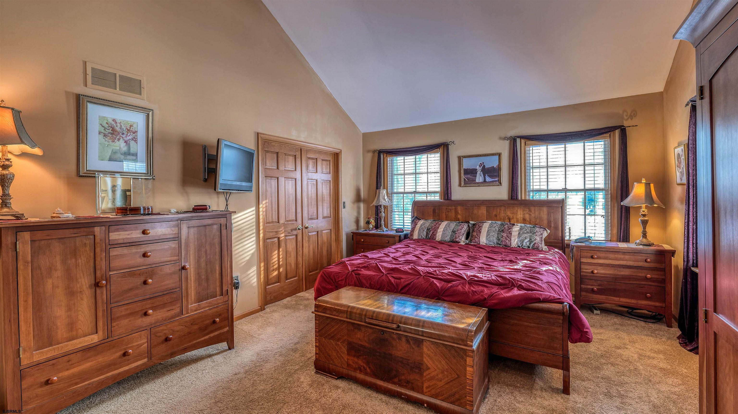 627 East Seaview Ridge Drive Galloway Township, NJ 08205 - Photo 35 of 50 a bedroom with a bed and a dresser