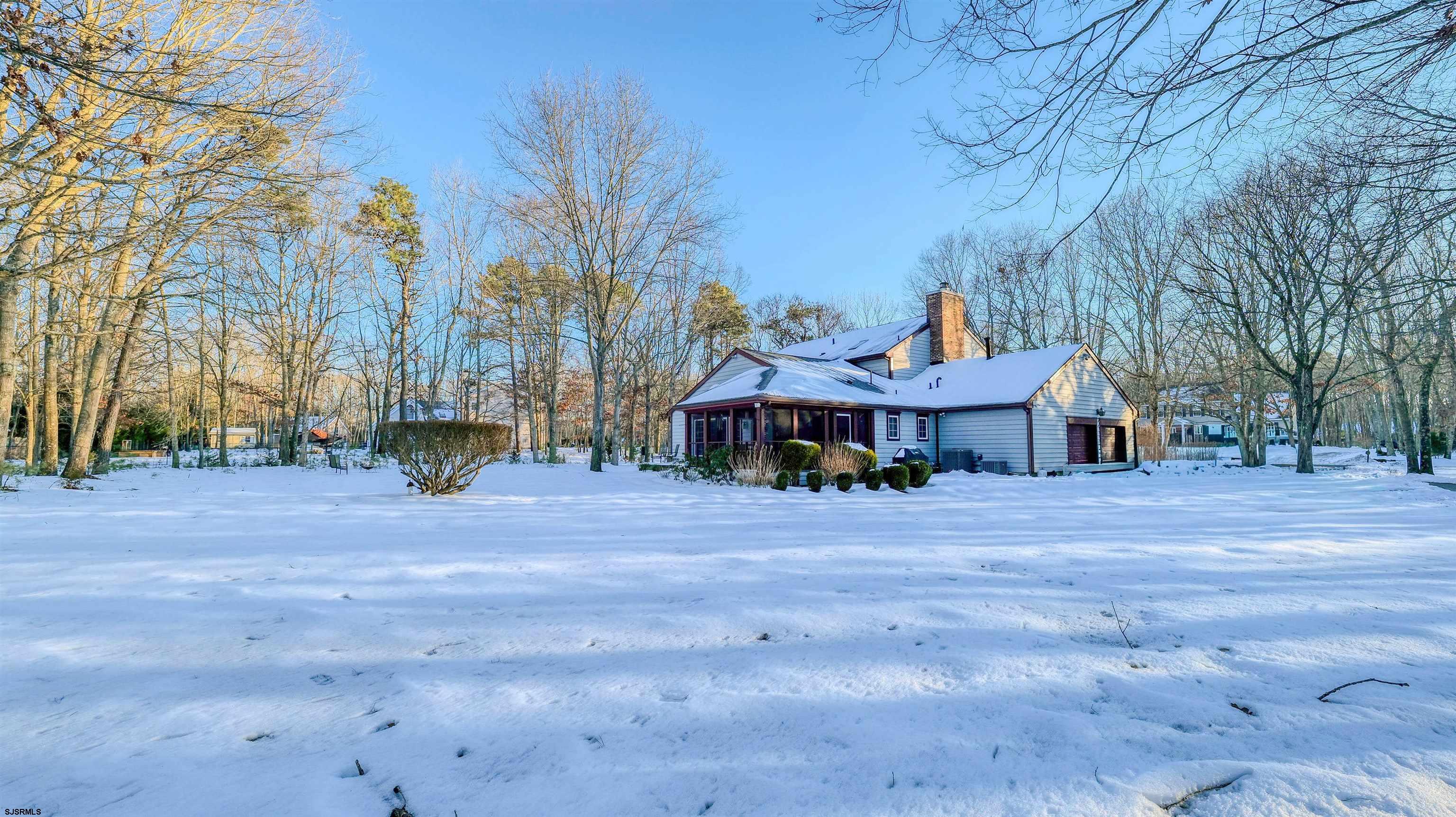 627 East Seaview Ridge Drive Galloway Township, NJ 08205 - Photo 4 of 50 a front view of a house with a yard