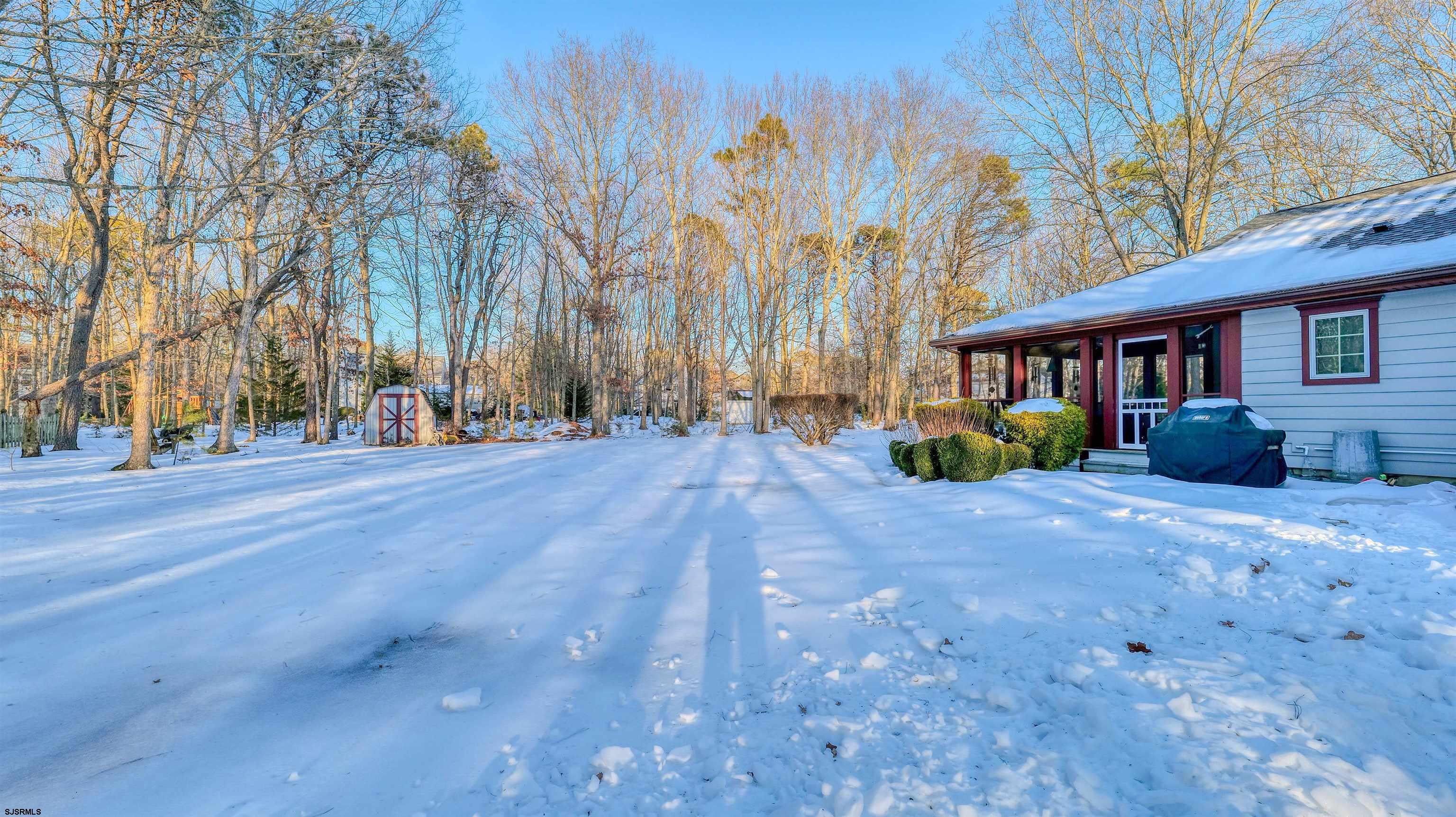 627 East Seaview Ridge Drive Galloway Township, NJ 08205 - Photo 41 of 50 a view of outdoor space with deck and trees