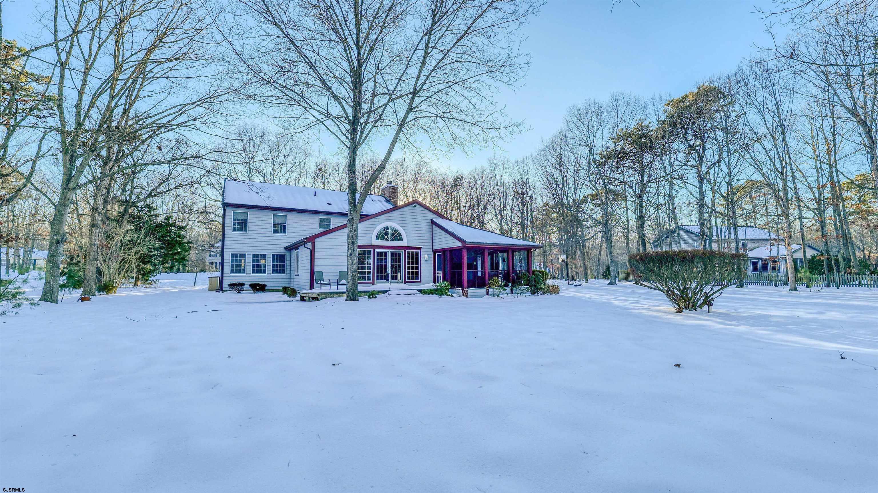 627 East Seaview Ridge Drive Galloway Township, NJ 08205 - Photo 42 of 50 a wooden house with trees in front of it