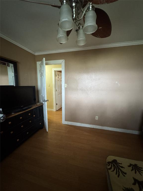 636 East Kempner Street Mabank, TX 75147 - Photo 14 of 28 Room featuring wood-finish flooring, a ceiling fan with integrated lighting, and white baseboards