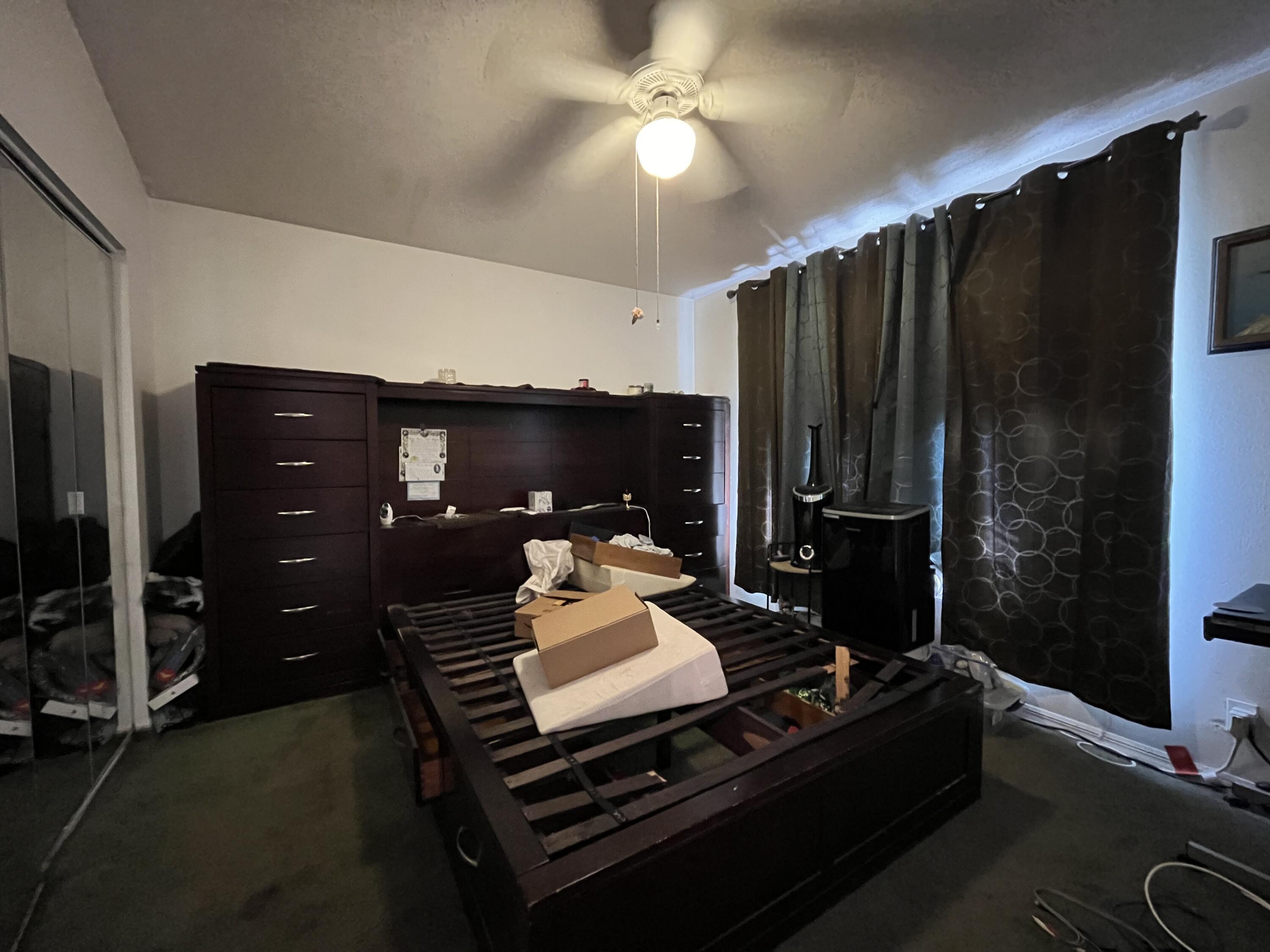 4919 Erin Lane Melbourne, FL 32940 - Photo 10 of 13 a living room with a table chairs and a fireplace
