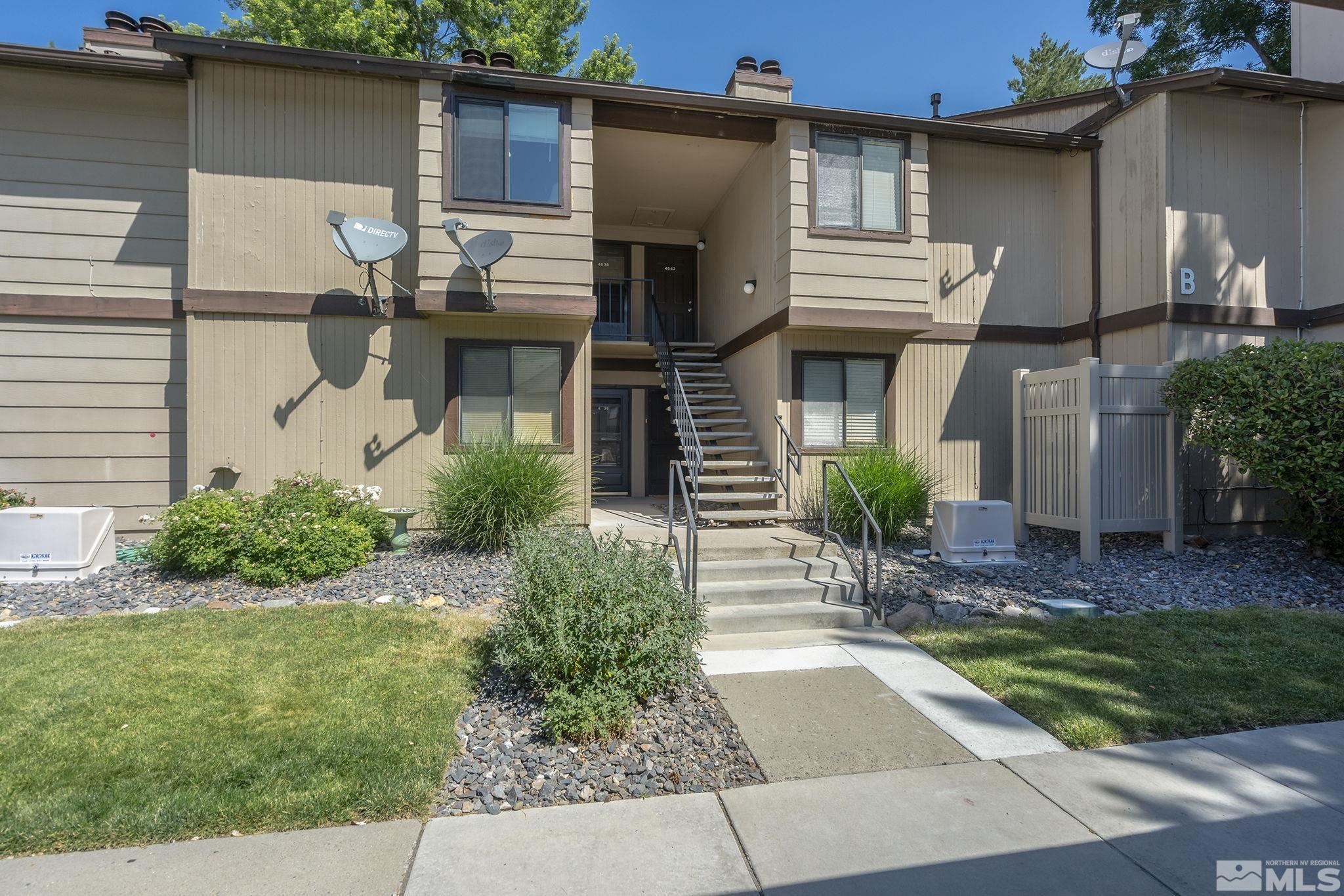 4640 Rio Poco Road Reno, NV 89502 - Photo 1 of 15 a front view of a house with garden