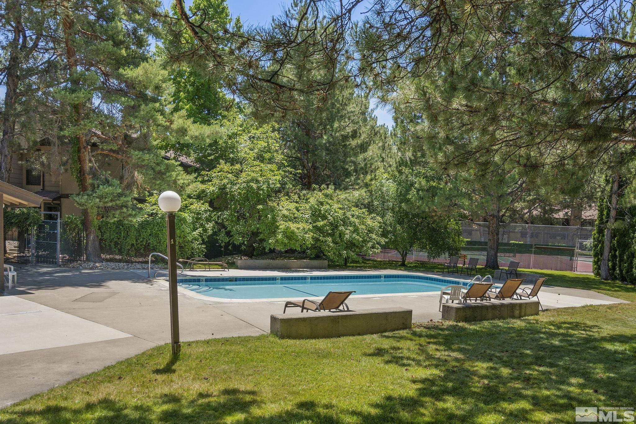 4640 Rio Poco Road Reno, NV 89502 - Photo 15 of 15 a view of a swimming pool with a patio