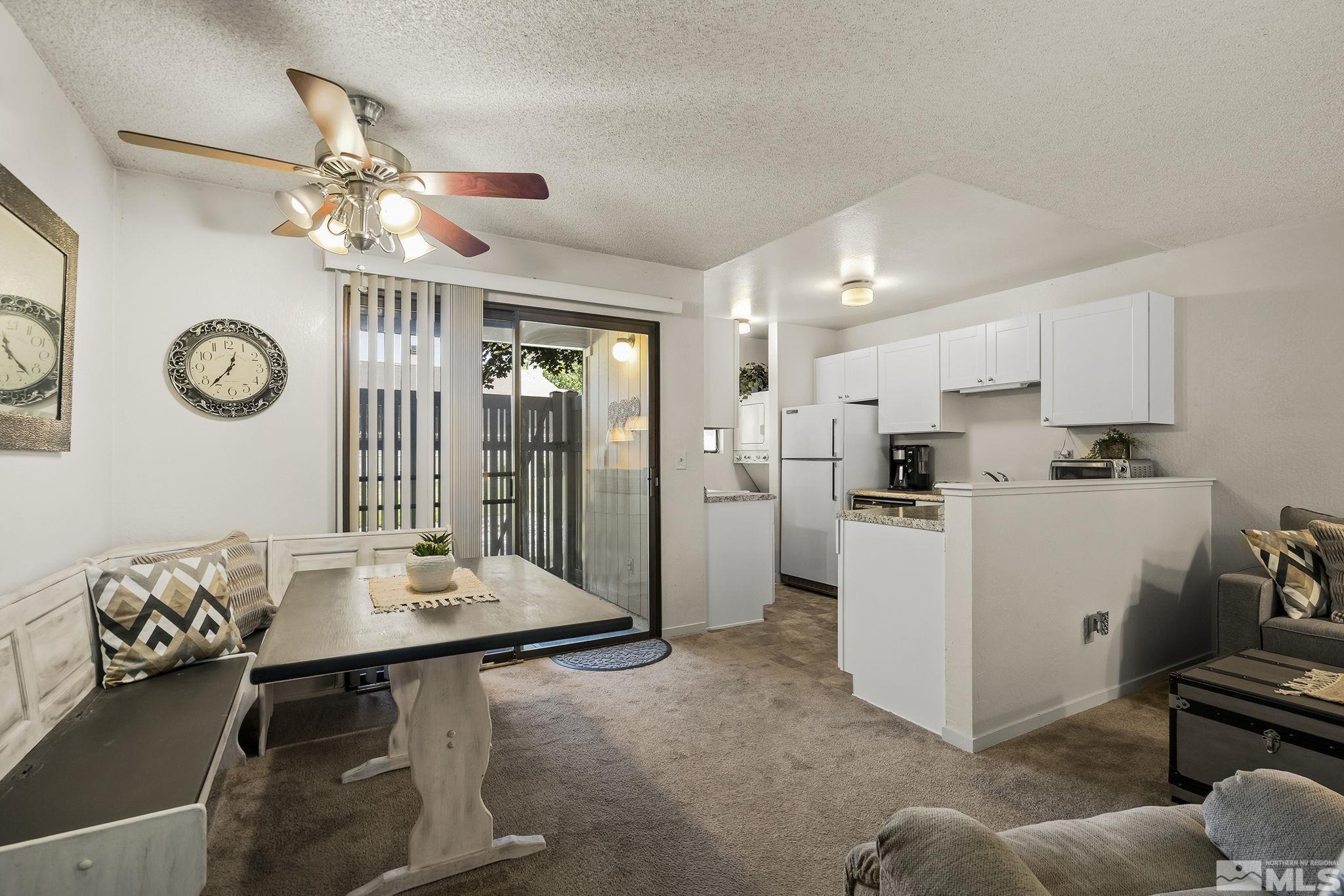 4640 Rio Poco Road Reno, NV 89502 - Photo 3 of 15 a kitchen with a table and chairs