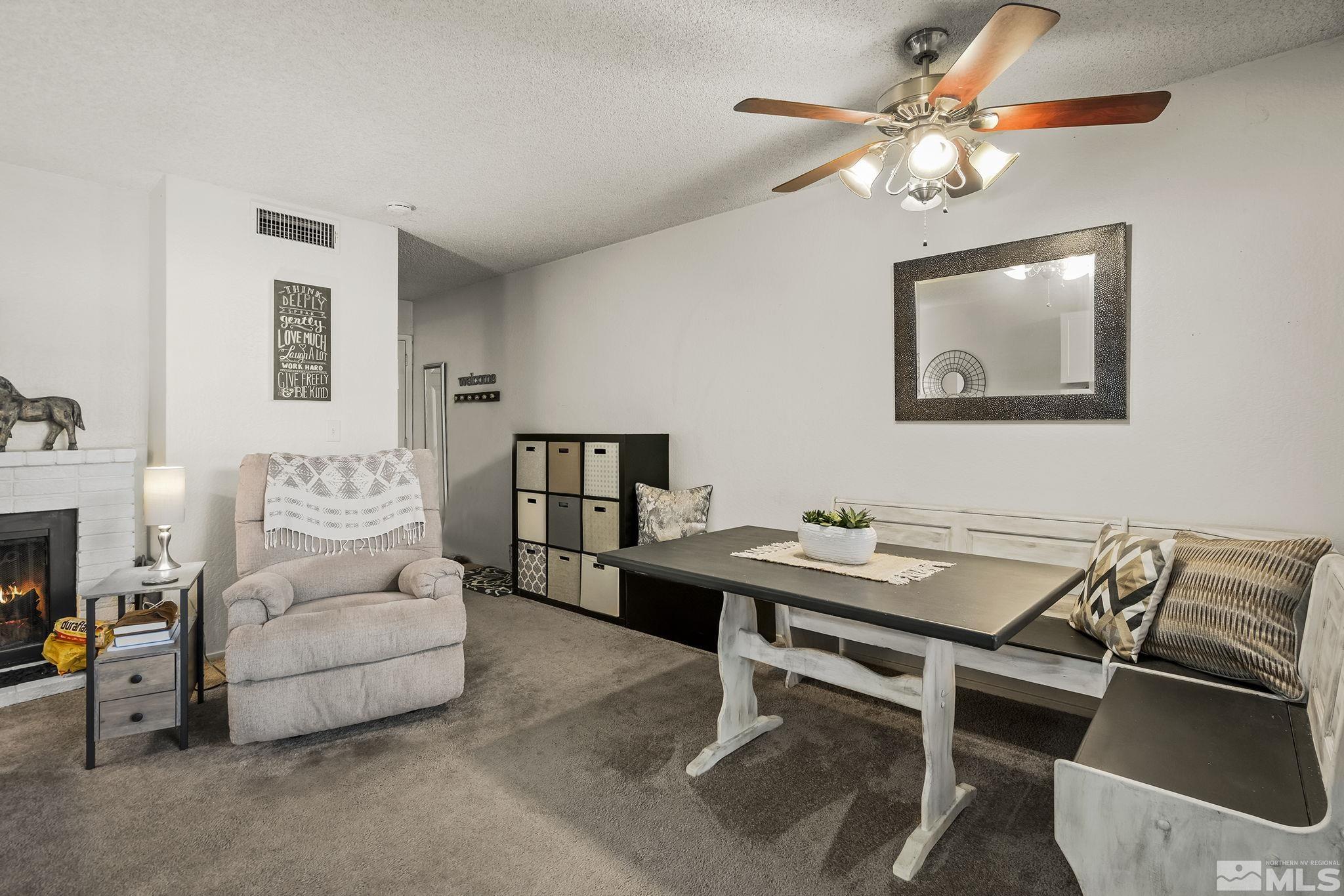 4640 Rio Poco Road Reno, NV 89502 - Photo 4 of 15 a view of a livingroom with furniture and a chandelier