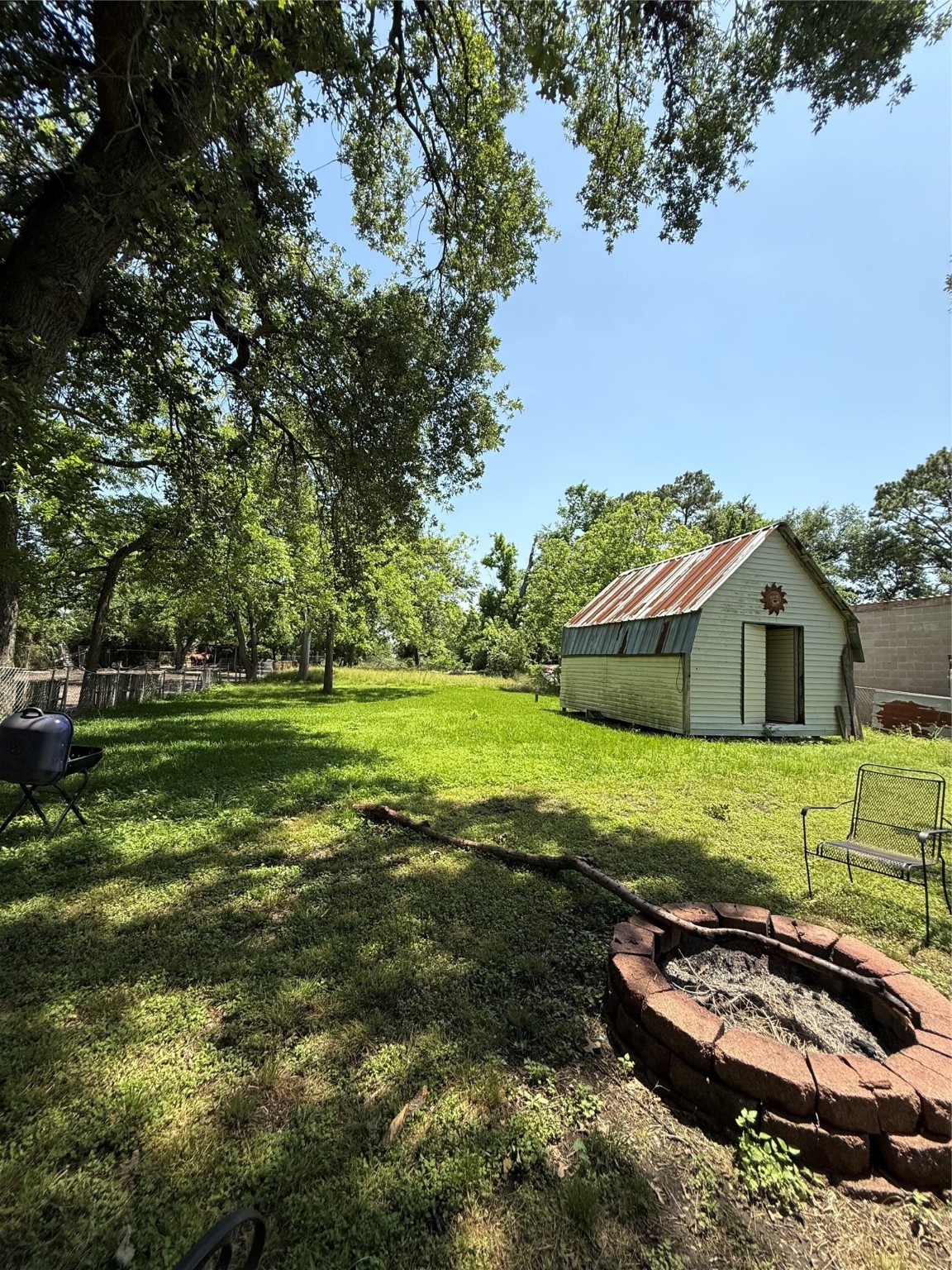 4312 Banner Drive Houston, TX 77013 - Photo 9 of 13 a backyard of a house with a yard and outdoor seating