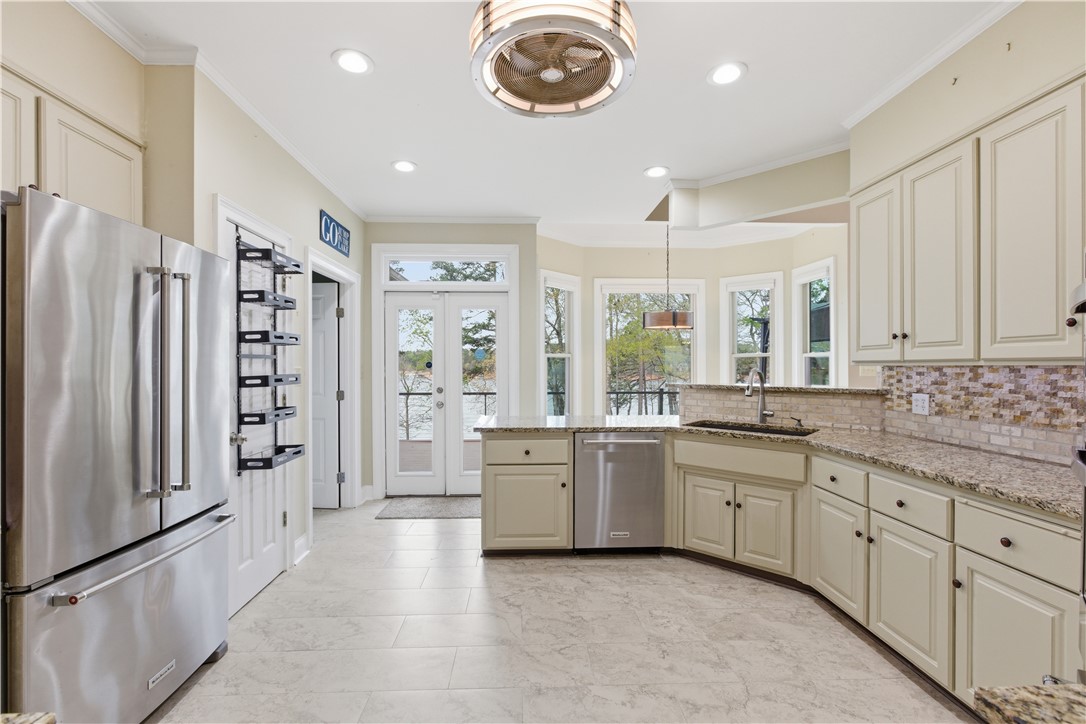 501 Capri Point Lavonia, GA 30553 - Photo 25 of 50 This bright kitchen features ample counter space, modern appliances, and a beautiful view of the outdoors.