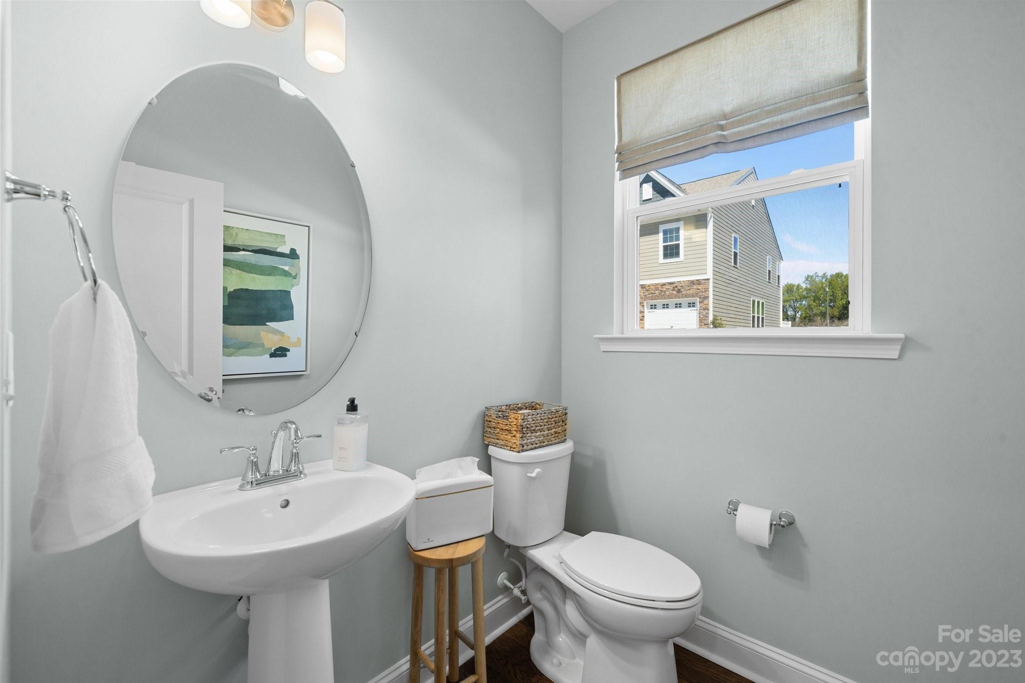 1031 South Point Road, Unit 9 Belmont, NC 28012 - Photo 13 of 21 a bathroom with a sink a mirror and a toilet