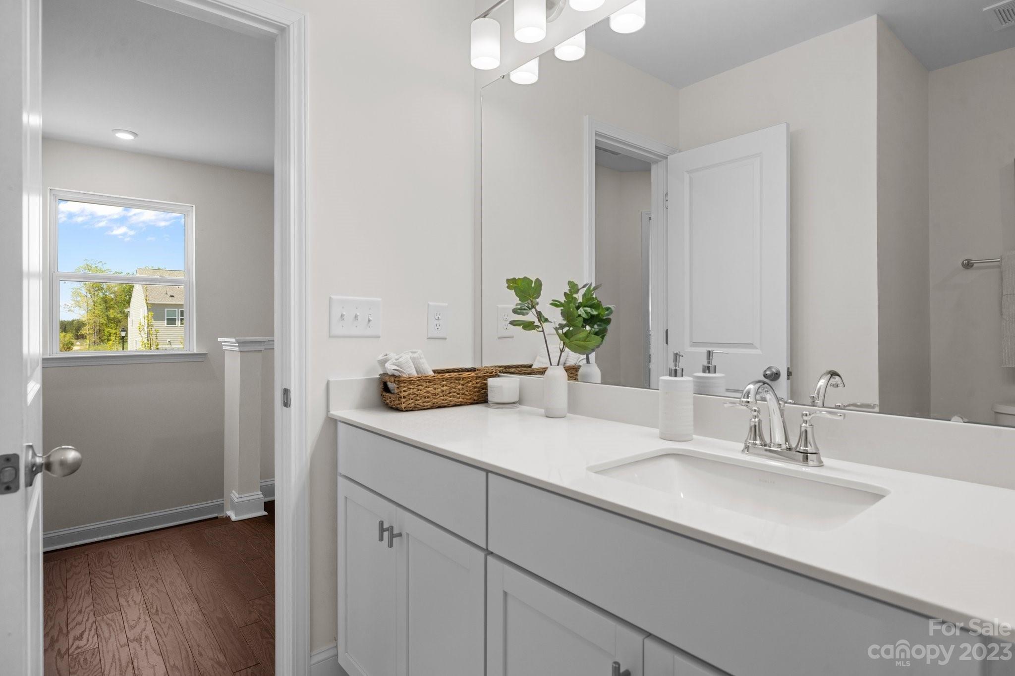 1031 South Point Road, Unit 9 Belmont, NC 28012 - Photo 20 of 21 a bathroom with a sink and a mirror