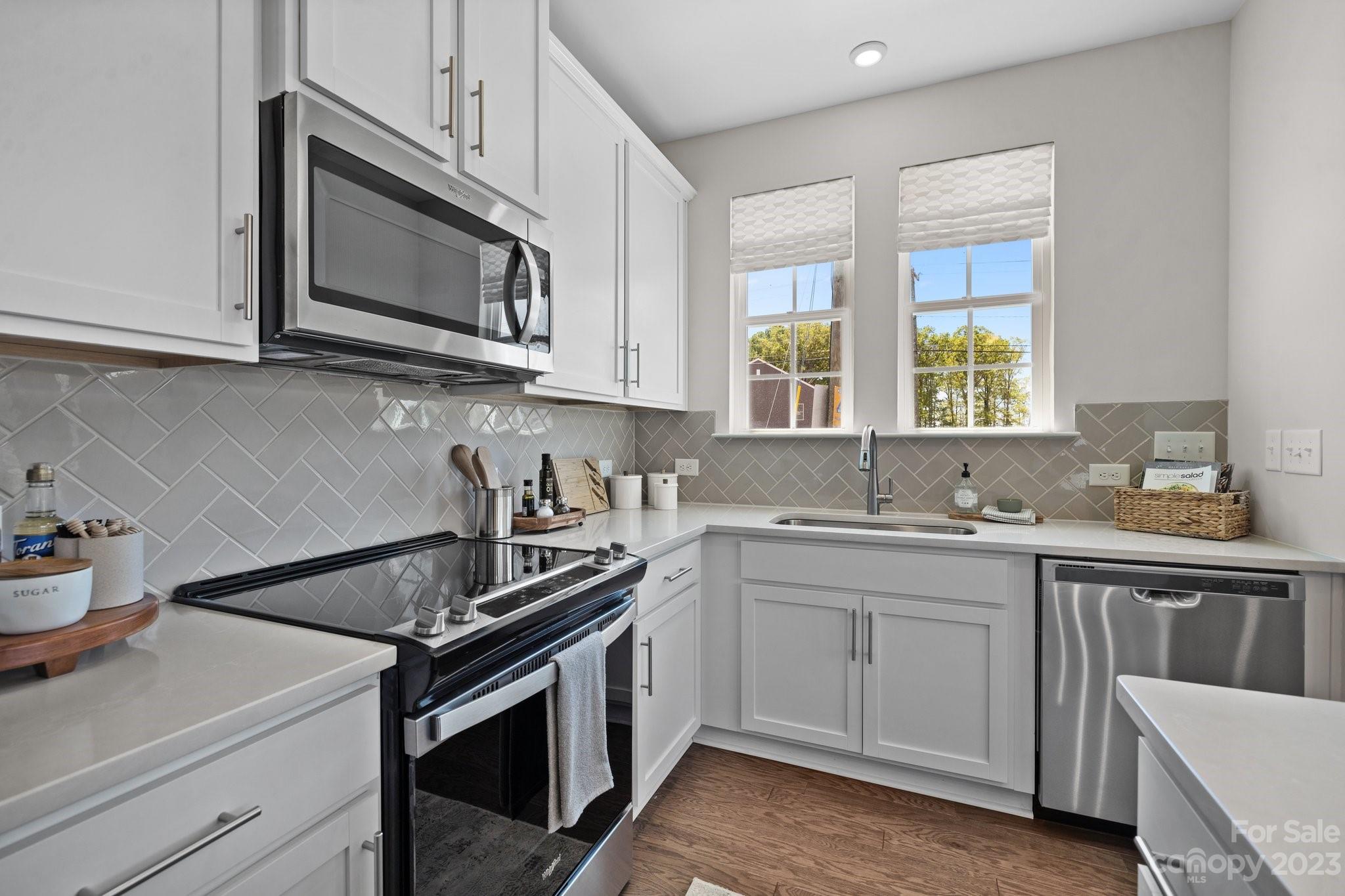 1031 South Point Road, Unit 9 Belmont, NC 28012 - Photo 7 of 21 a kitchen with a sink stove and microwave
