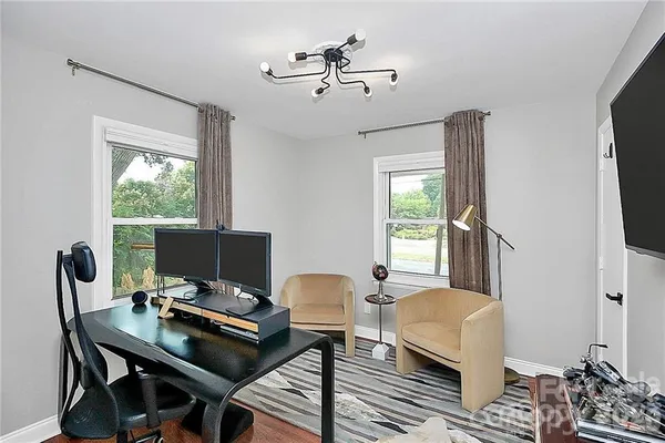 a workspace with furniture and a window