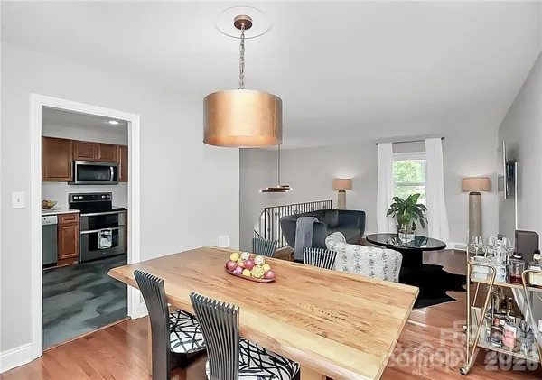 a very nice looking dining room with a table and chairs
