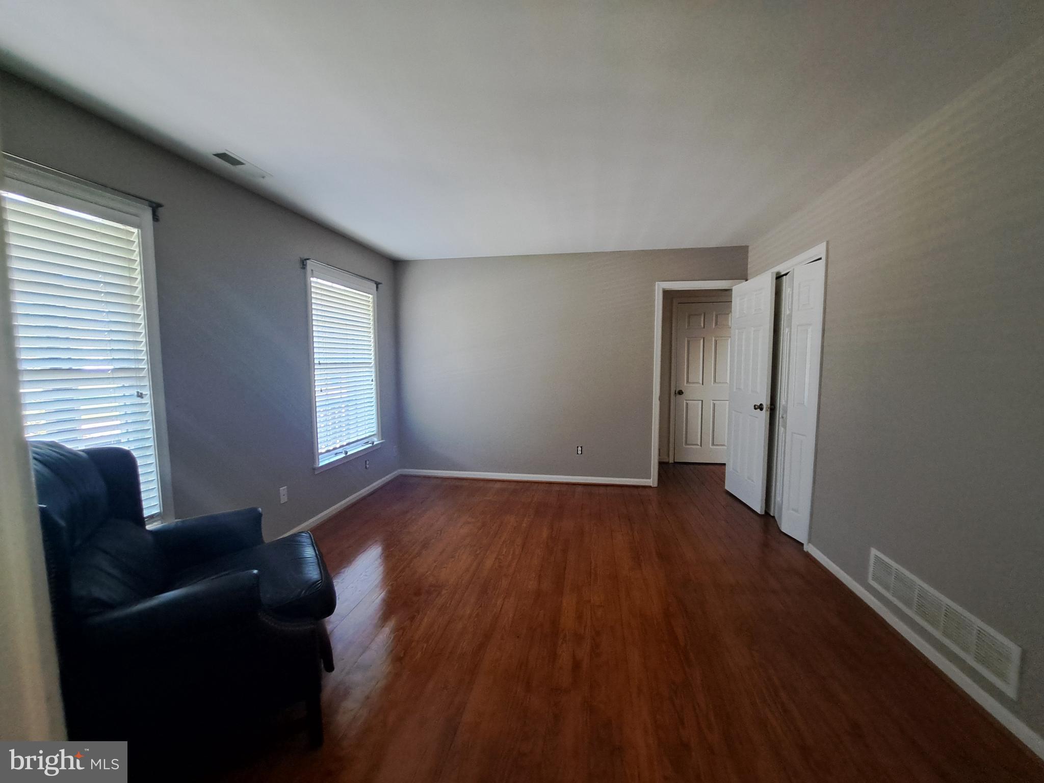 123 New Road Lewes, DE 19958 - Photo 21 of 29 a view of an empty room with wooden floor and a window