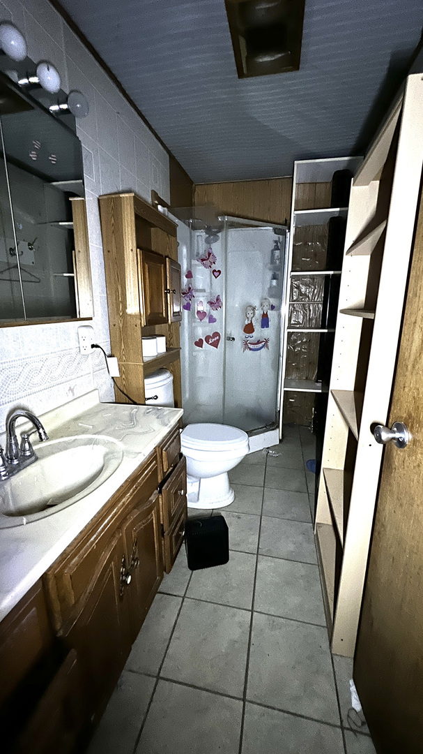 8919 Meredosia Road Albany, IL 61230 - Photo 23 of 35 a bathroom with a granite countertop sink toilet and a mirror