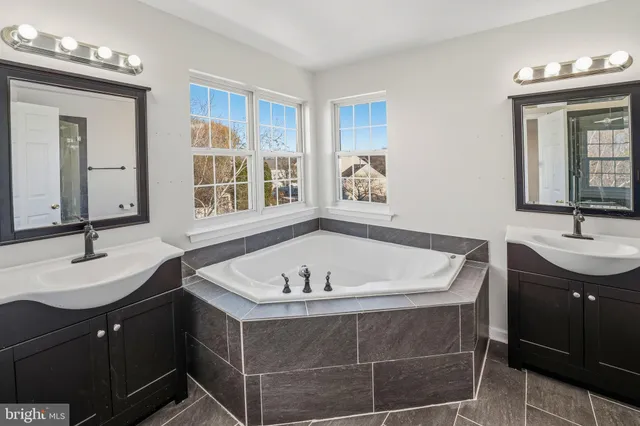 a bath room with a sink and a mirror