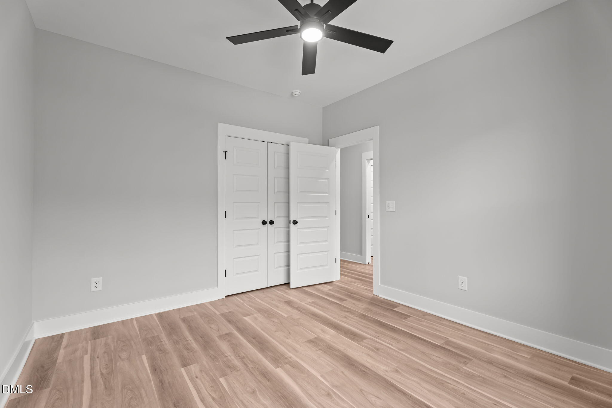 327 Little Lady Trail Zebulon, NC 27597 - Photo 22 of 49 a view of empty room with wooden floor
