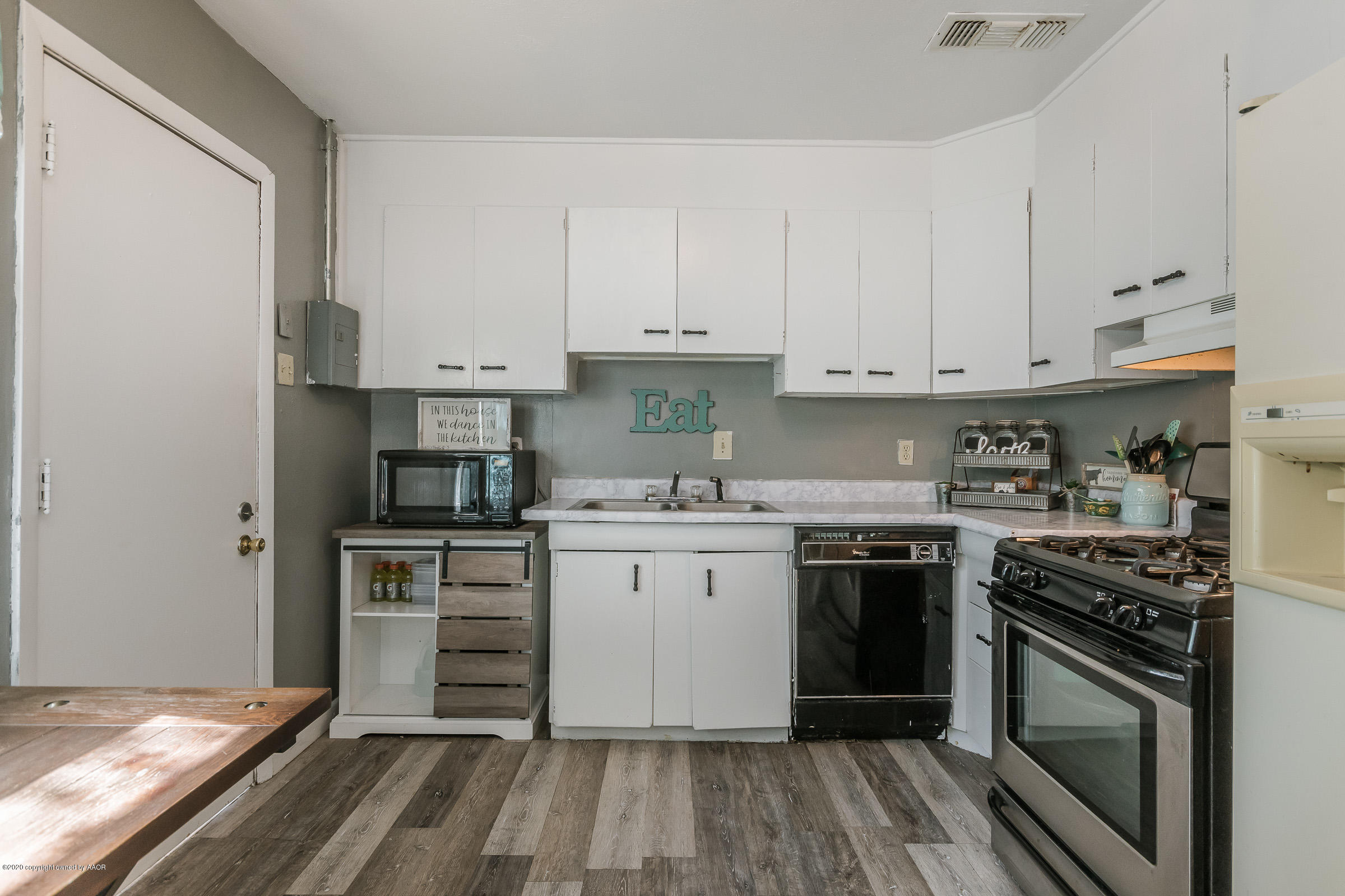 4311 South Monroe Street Amarillo, TX 79110 - Photo 7 of 17 a kitchen with a stove oven and sink