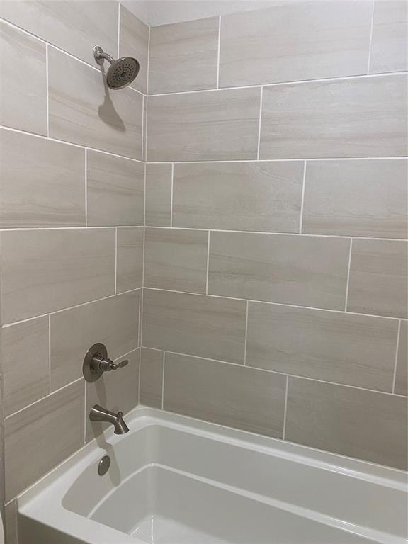 209 Johnson Street Granbury, TX 76048 - Photo 36 of 40 Bathroom with tiled shower / bath