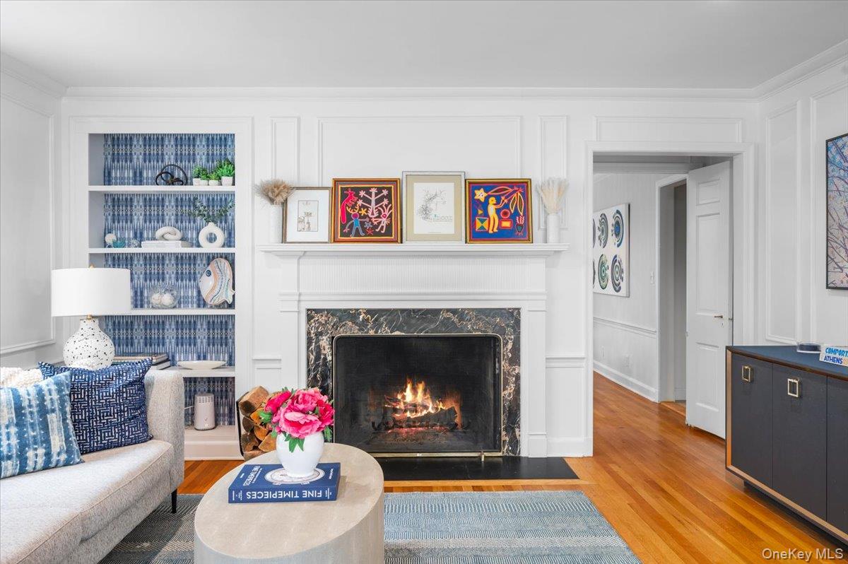 49 Eton Road Larchmont, NY 10538 - Photo 5 of 34 a living room with furniture and a fireplace