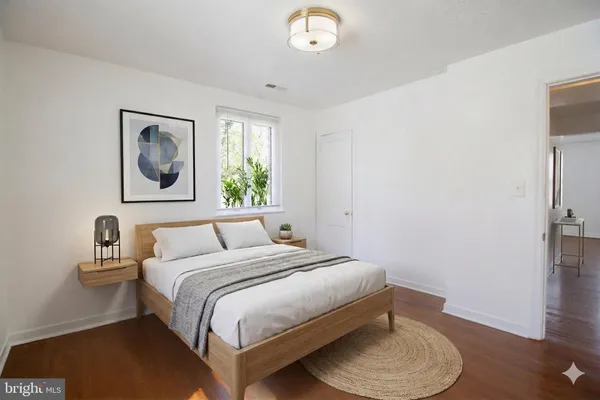 a bedroom with a bed and a chair