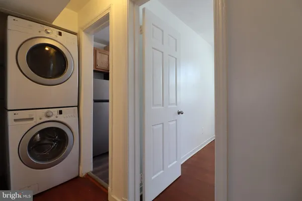 a view of a hallway with washer and dryer