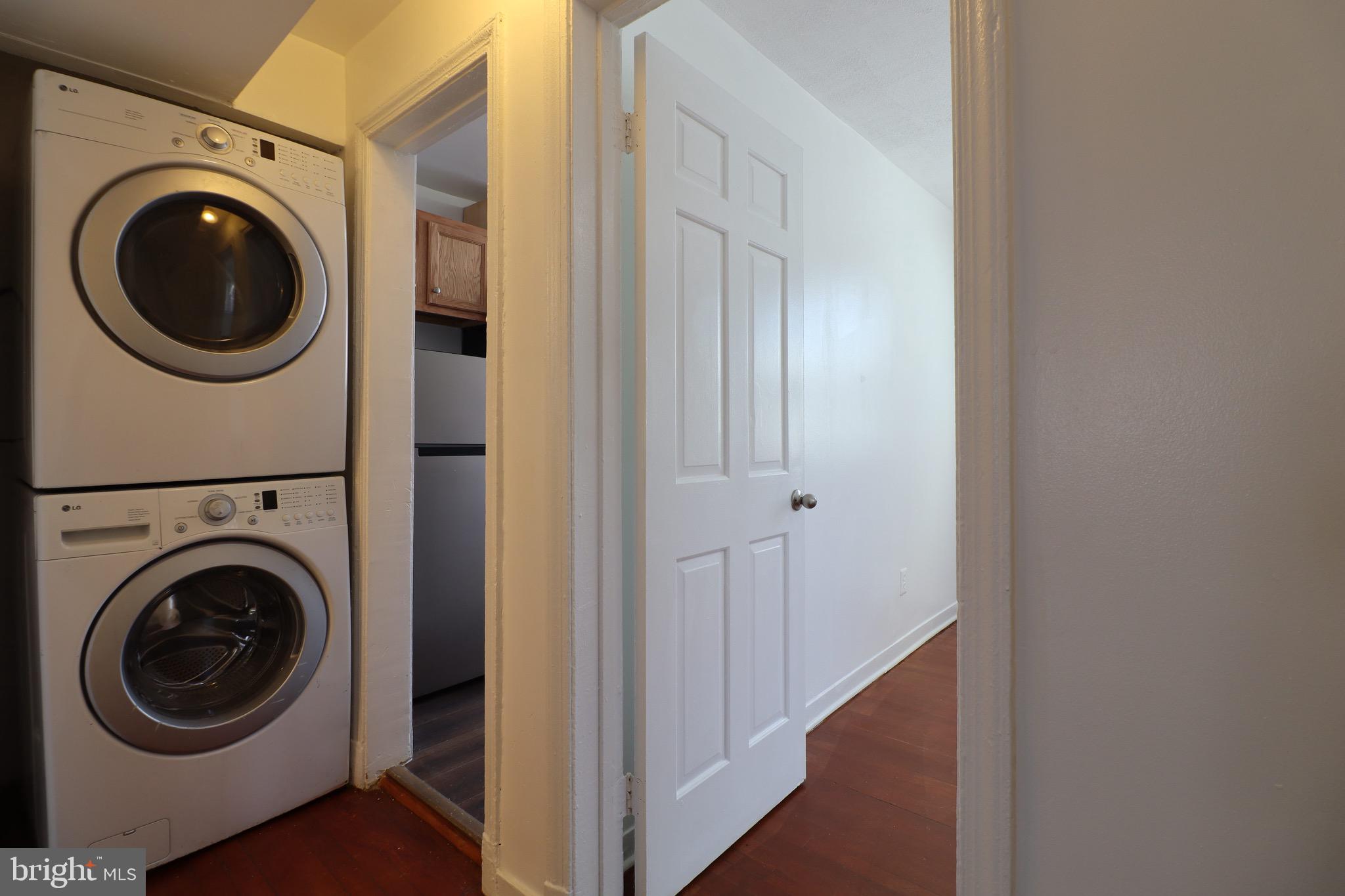 407 Lebaum Street Southeast, Unit 1 Washington, DC 20032 - Photo 8 of 11 a view of a hallway with washer and dryer