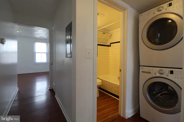 a view of a hallway with washer and dryer