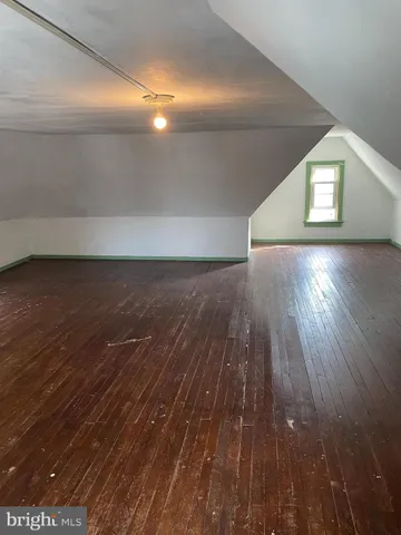 a view of a livingroom with wooden floor