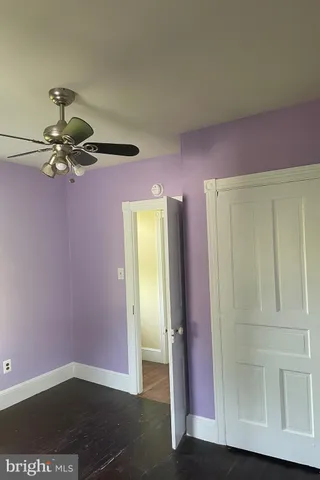 an empty room with a mirror