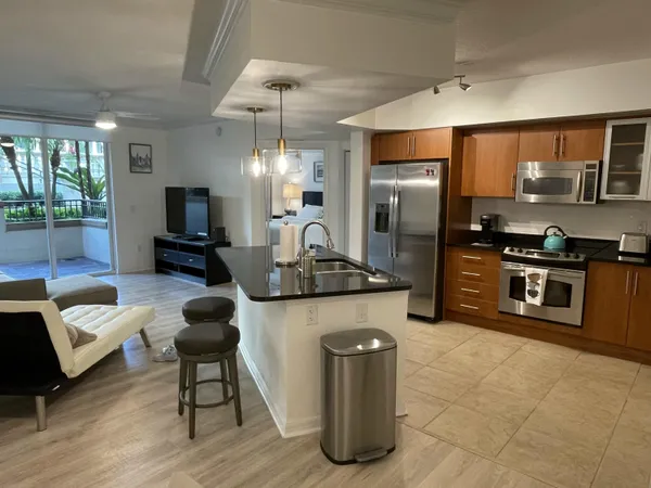 a kitchen with a refrigerator and a sink