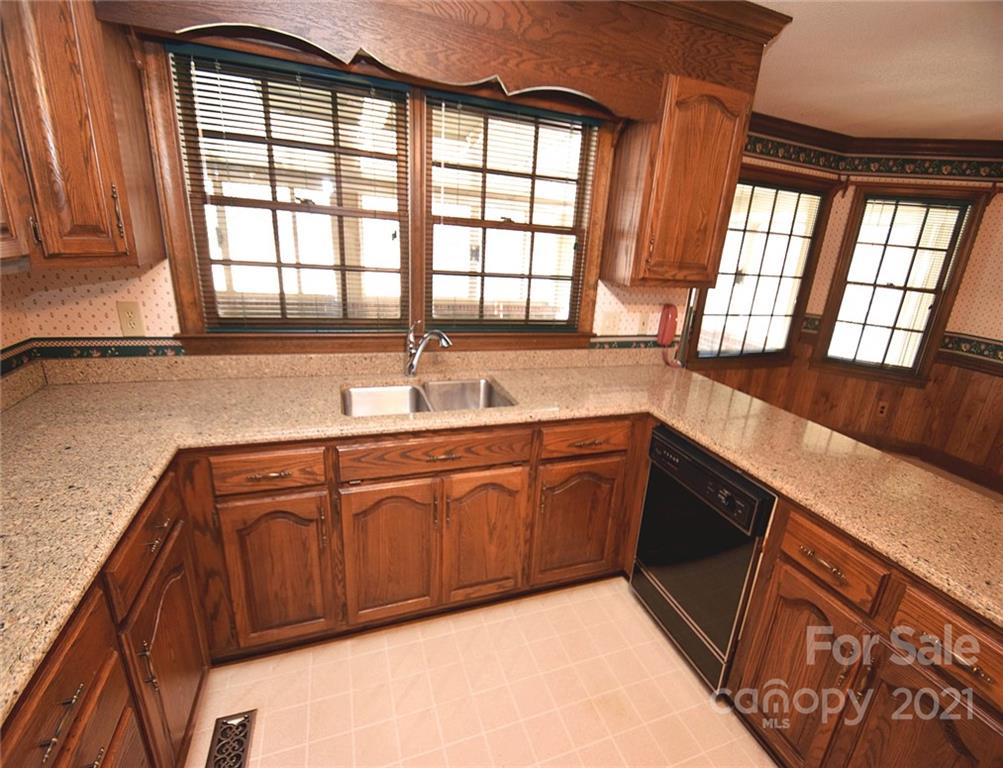 2192 State Rd S-46-883 Clover, SC 29710 - Photo 14 of 42 a kitchen with stainless steel appliances granite countertop a sink and a large window