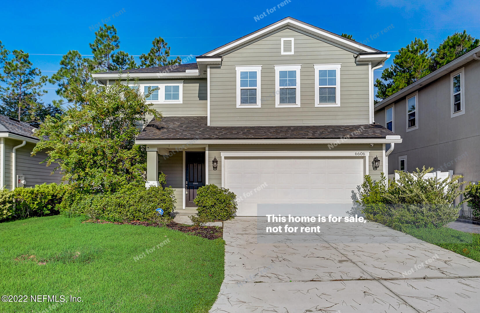 6606 Azalea Park Road Jacksonville, FL 32259 - Photo 1 of 26 a front view of a house with a garden and plants